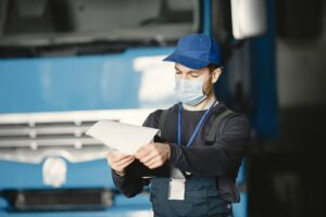 person with preventive maintenance checklist